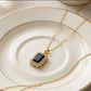 The Midnight Rectangle Halo Pendant.